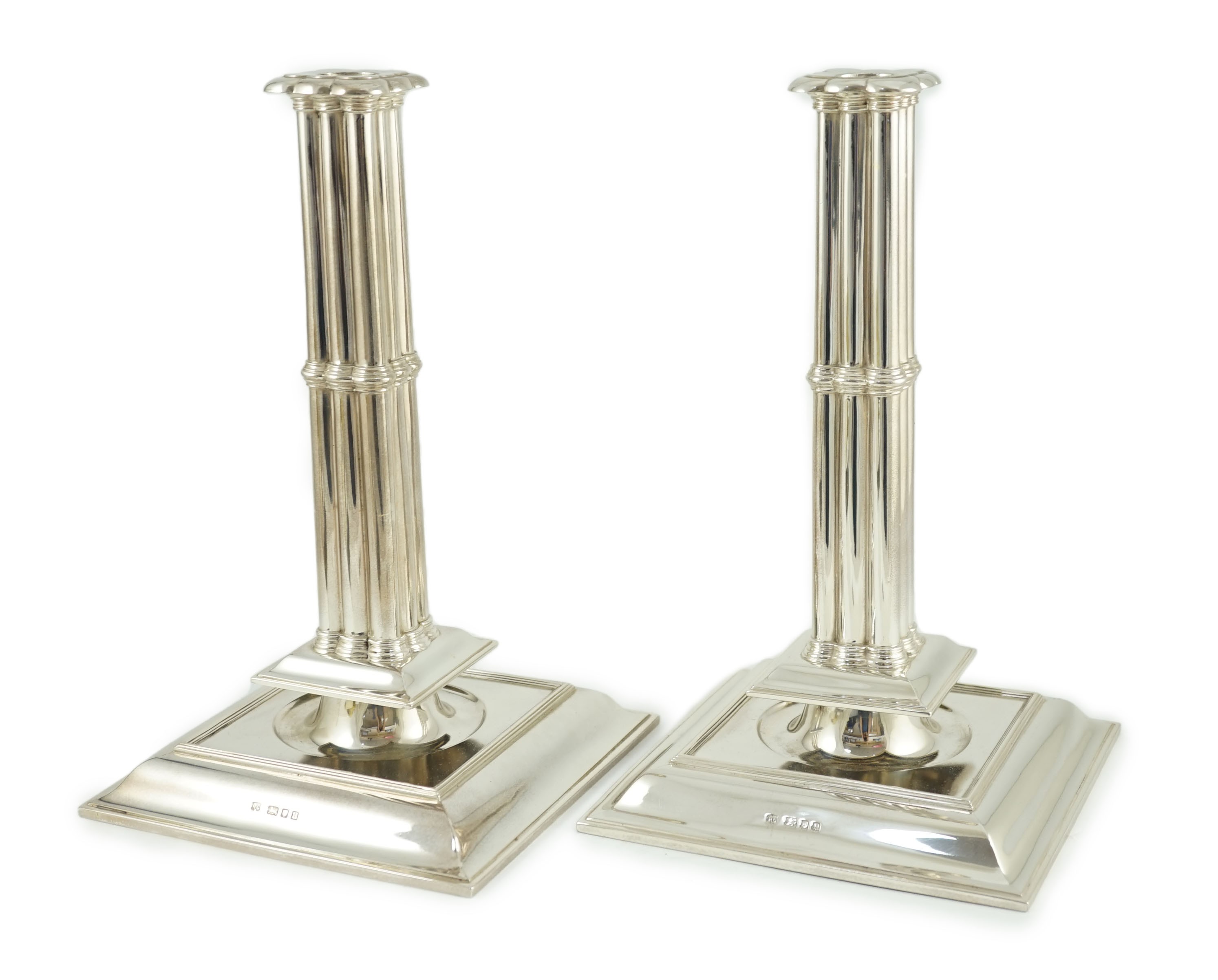 A large pair of George V silver cluster column candlesticks, by William Comyns & Sons Ltd